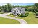 Aerial angle showcasing a white two-story home, garage and well-maintained lawn at 2508 Kearney Rd, Wake Forest, NC 27587