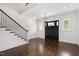 Bright entryway with hardwood floors, shiplap walls and a black front door at 2508 Kearney Rd, Wake Forest, NC 27587