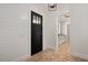 Entry hall with brick floors, white walls and black door leads into the home at 2508 Kearney Rd, Wake Forest, NC 27587