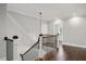 Bright hallway boasts hardwood floors, white trim, and a staircase with dark wood accents at 2508 Kearney Rd, Wake Forest, NC 27587