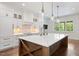 Beautiful kitchen with white cabinets, a herringbone backsplash, and a spacious marble island at 2508 Kearney Rd, Wake Forest, NC 27587
