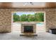 A picturesque outdoor fireplace and pool area with lush greenery at 2508 Kearney Rd, Wake Forest, NC 27587