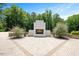 An outdoor patio offers a central fireplace and comfortable seating for relaxing in the backyard at 2508 Kearney Rd, Wake Forest, NC 27587