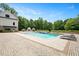 A large swimming pool with surrounding patio and landscaped backyard at 2508 Kearney Rd, Wake Forest, NC 27587