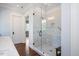 Modern glass enclosed shower featuring white tile at 2508 Kearney Rd, Wake Forest, NC 27587