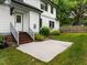 Spacious backyard with patio area and verdant lawn, perfect for outdoor entertaining or serene relaxation at 2551 Drake Ave, Durham, NC 27705