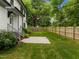 Well-maintained backyard featuring a wooden fence, patio, and lush greenery, perfect for relaxation and outdoor activities at 2551 Drake Ave, Durham, NC 27705