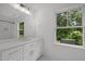 A bright bathroom has subway tile, vanity, and modern fixtures at 2551 Drake Ave, Durham, NC 27705