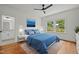 Bright bedroom featuring a ceiling fan, ensuite bathroom and a scenic view at 2551 Drake Ave, Durham, NC 27705