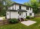Well-maintained home exterior with a lush green lawn, concrete patio and privacy fence at 2551 Drake Ave, Durham, NC 27705