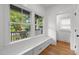 Cozy sitting area with built-in bench and view of the front yard at 2551 Drake Ave, Durham, NC 27705