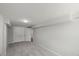 Finished basement area with closet space and neutral color scheme at 2617 Fayetteville St, Durham, NC 27707