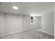 Basement area with plush carpeting and natural light at 2617 Fayetteville St, Durham, NC 27707