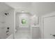Bright bathroom with marble floors, subway tile shower, and modern fixtures at 2617 Fayetteville St, Durham, NC 27707