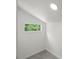 Small bedroom area featuring a window and carpeting at 2617 Fayetteville St, Durham, NC 27707