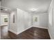 Recently renovated living area featuring hardwood floors, crown moulding, and an entry door to the exterior at 2617 Fayetteville St, Durham, NC 27707