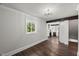 Cozy space with refinished hardwood floors, stylish lighting, and an open kitchen at 2617 Fayetteville St, Durham, NC 27707