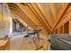 Spacious unfinished attic featuring exposed wooden beams, offering potential for customization or storage at 3034 Lewis Farm Rd, Raleigh, NC 27607