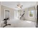Bright bedroom featuring a ceiling fan, natural light and plenty of open space at 3034 Lewis Farm Rd, Raleigh, NC 27607