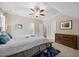 Cozy bedroom with carpeting, ceiling fan, crown molding, and windows that provide plenty of natural light at 3034 Lewis Farm Rd, Raleigh, NC 27607