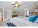 Bright bedroom featuring crown molding, a ceiling fan, and comfortable carpeting for a cozy feel at 3034 Lewis Farm Rd, Raleigh, NC 27607