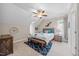 Comfortable bedroom featuring a ceiling fan, carpet, and a window that provides natural light at 3034 Lewis Farm Rd, Raleigh, NC 27607