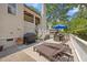 Outdoor deck area with a grill, dining set, and lounge chairs for relaxing outdoors at 3034 Lewis Farm Rd, Raleigh, NC 27607