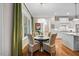 Cozy breakfast nook with a round table and wicker chairs bathed in natural light at 3034 Lewis Farm Rd, Raleigh, NC 27607
