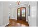 Welcoming entryway showcasing hardwood floors and an arched glass door at 3034 Lewis Farm Rd, Raleigh, NC 27607