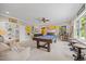Game room featuring a pool table, bar seating, and cheerful decorations at 3034 Lewis Farm Rd, Raleigh, NC 27607