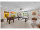 Spacious game room with a pool table, foosball, and ample space for entertainment and relaxation at 3034 Lewis Farm Rd, Raleigh, NC 27607