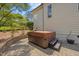 Relaxing hot tub area with a stone surround and manicured landscaping at 3034 Lewis Farm Rd, Raleigh, NC 27607