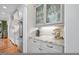 Butler's pantry features gray cabinets, granite countertops, and glass-front display cabinets at 3034 Lewis Farm Rd, Raleigh, NC 27607
