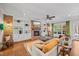 Inviting living room featuring a fireplace, built-in shelves, and hardwood floors at 3034 Lewis Farm Rd, Raleigh, NC 27607