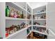Walk-in pantry with ample shelving stocked with spices, oils, canned goods, and other kitchen staples at 3034 Lewis Farm Rd, Raleigh, NC 27607