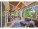 Inviting covered patio featuring a fireplace, comfortable seating, and outdoor living space at 3034 Lewis Farm Rd, Raleigh, NC 27607