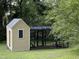Charming chicken coop with enclosed run provides a safe and functional space for poultry at 313 W Noble St, Louisburg, NC 27549