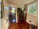 Bright entryway featuring hardwood floors, a window, and a view into the dining room at 313 W Noble St, Louisburg, NC 27549
