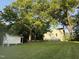 Exterior shot of charming home with well-maintained lawn and mature trees at 313 W Noble St, Louisburg, NC 27549