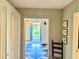 Inviting entryway with black and white checkered floors, an open door to the lawn, and stylish interior design at 313 W Noble St, Louisburg, NC 27549