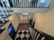 Grand foyer featuring checkerboard floors, a striking chandelier, and a staircase leading to the upper level at 313 W Noble St, Louisburg, NC 27549