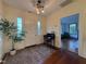 Welcoming foyer with hardwood floors, a desk, a large plant, and an entryway flooded with natural light at 313 W Noble St, Louisburg, NC 27549