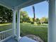 Expansive front yard featuring lush greenery and mature trees, as seen from the porch at 313 W Noble St, Louisburg, NC 27549
