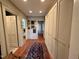 Inviting hallway featuring hardwood floors, storage, and tasteful decor leading to other rooms at 313 W Noble St, Louisburg, NC 27549