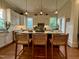 Bright kitchen with granite countertops, subway tile backsplash, and island seating at 313 W Noble St, Louisburg, NC 27549