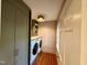 Convenient laundry room with washer, dryer, storage cabinets, and a well-lit space at 313 W Noble St, Louisburg, NC 27549