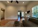 Cozy living room with hardwood floors, comfortable seating, and natural light from a large window at 313 W Noble St, Louisburg, NC 27549