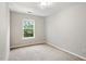 Cozy bedroom with carpet flooring and natural light streaming through the window, creating a serene space at 330 Gilman Ln # 109, Raleigh, NC 27610