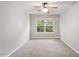 Inviting bedroom featuring a ceiling fan, neutral carpet and a bright window at 330 Gilman Ln # 109, Raleigh, NC 27610