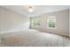 Spacious bedroom with bright windows, neutral carpet and ceiling fan at 330 Gilman Ln # 109, Raleigh, NC 27610